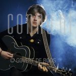 09-02-1978 Nick Lowe at studio in Amsterdam.

[keywords]Posed, Half Length, Guitar[/keywords]